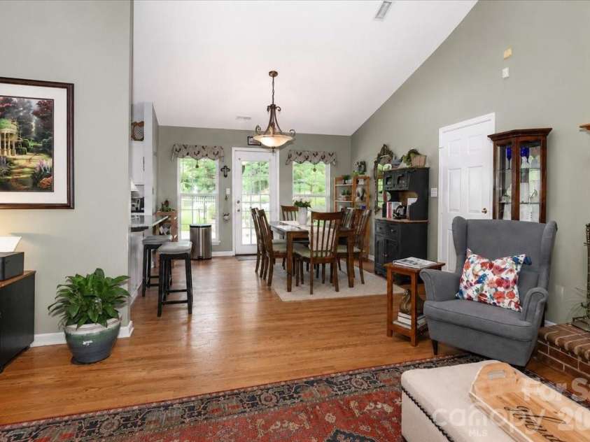 6803 Lowesville Lane, Stanley, NC 28164.  MLS# CAR4385358, YatesRealty ID 30226. Living room looking into dining area