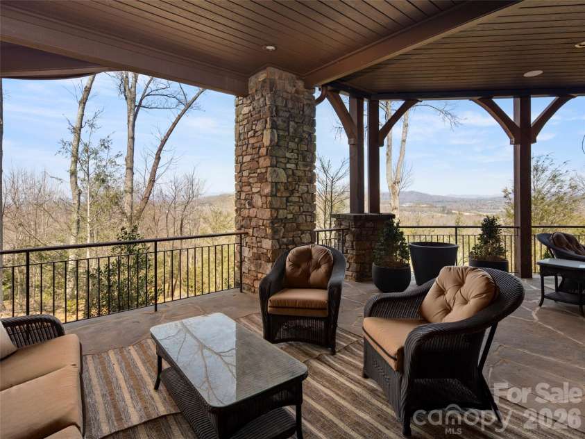 47 Ridge Pine Trail, Arden, NC 28704.  MLS# CAR4370746, YatesRealty ID 30234. Covered dock by one of two deck fireplaces