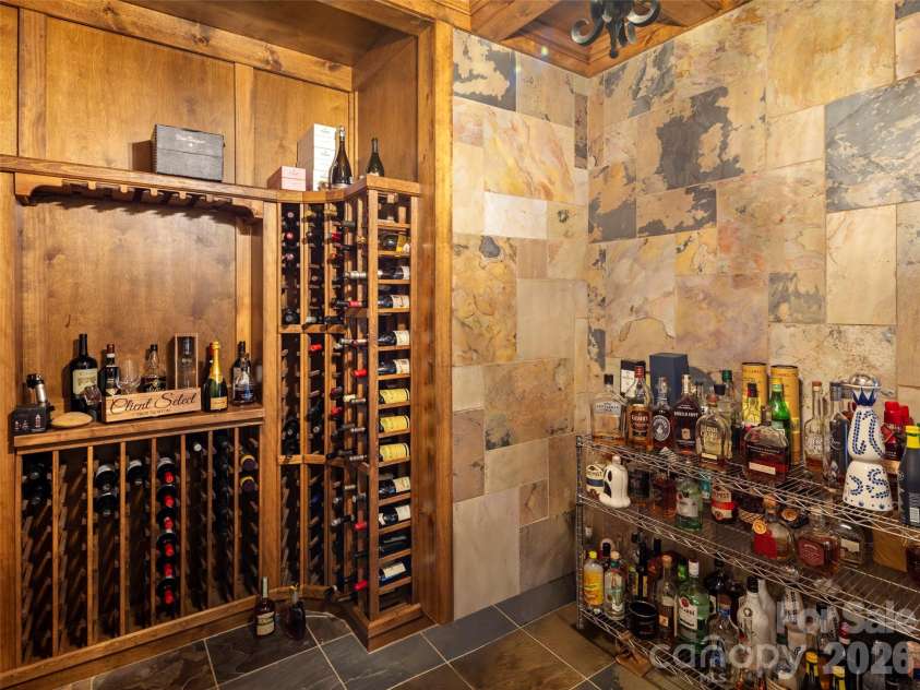 47 Ridge Pine Trail, Arden, NC 28704.  MLS# CAR4370746, YatesRealty ID 30234. Custom, spacious, walk in wine cellar