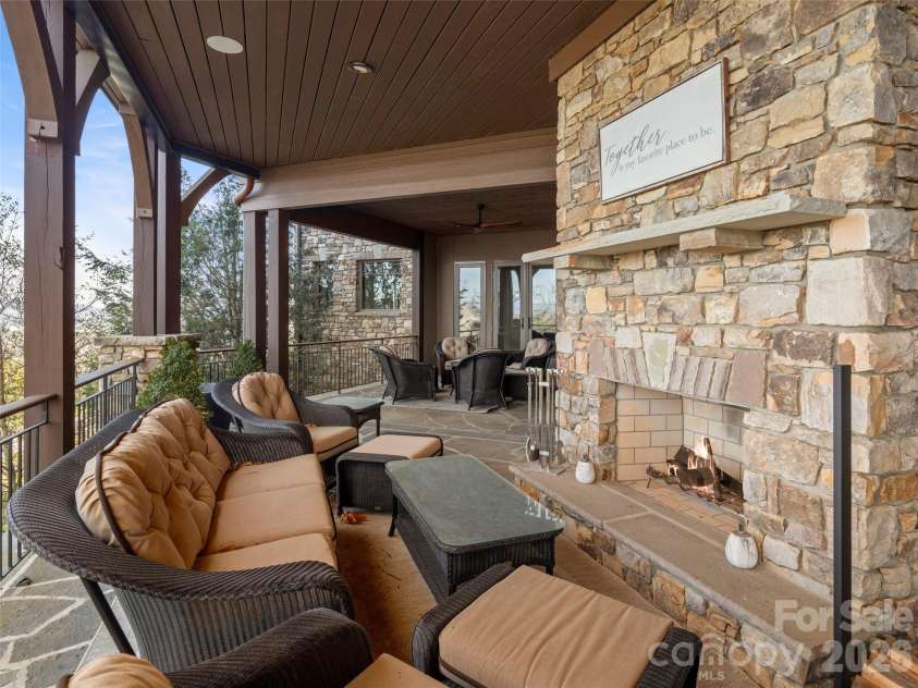 47 Ridge Pine Trail, Arden, NC 28704.  MLS# CAR4370746, YatesRealty ID 30234. Deck area fireplace