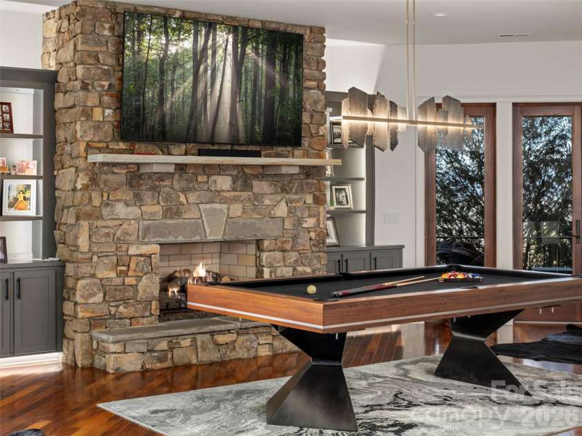 47 Ridge Pine Trail, Arden, NC 28704.  MLS# CAR4370746, YatesRealty ID 30234. Entertainment area pool table and fireplace