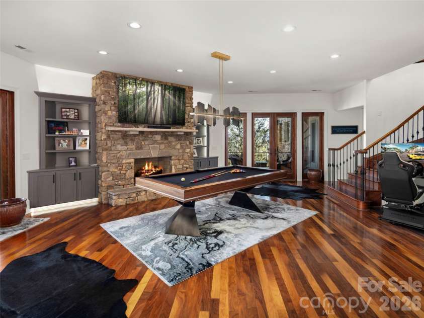 47 Ridge Pine Trail, Arden, NC 28704.  MLS# CAR4370746, YatesRealty ID 30234. Entertainment area with pool table and fireplace