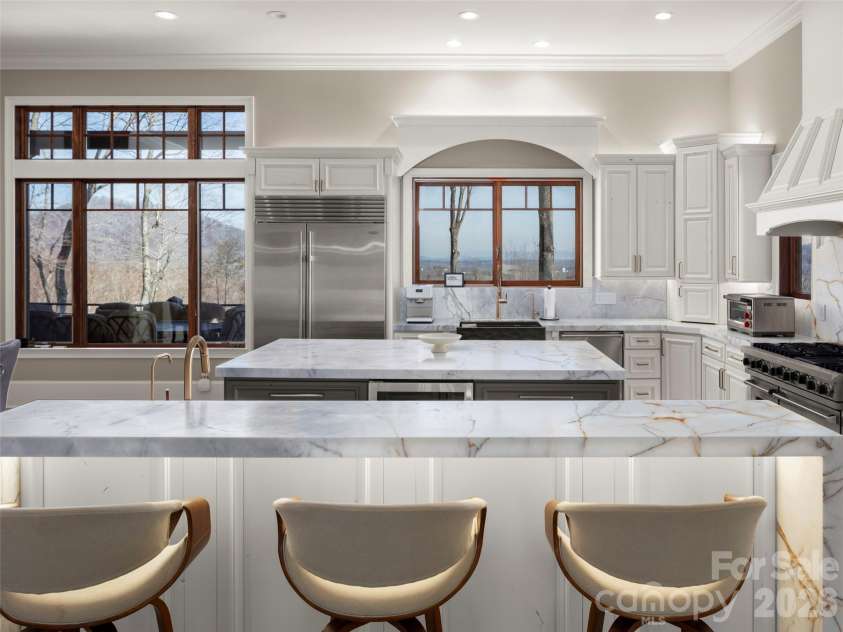 47 Ridge Pine Trail, Arden, NC 28704.  MLS# CAR4370746, YatesRealty ID 30234. Kitchen from the formal dinning area