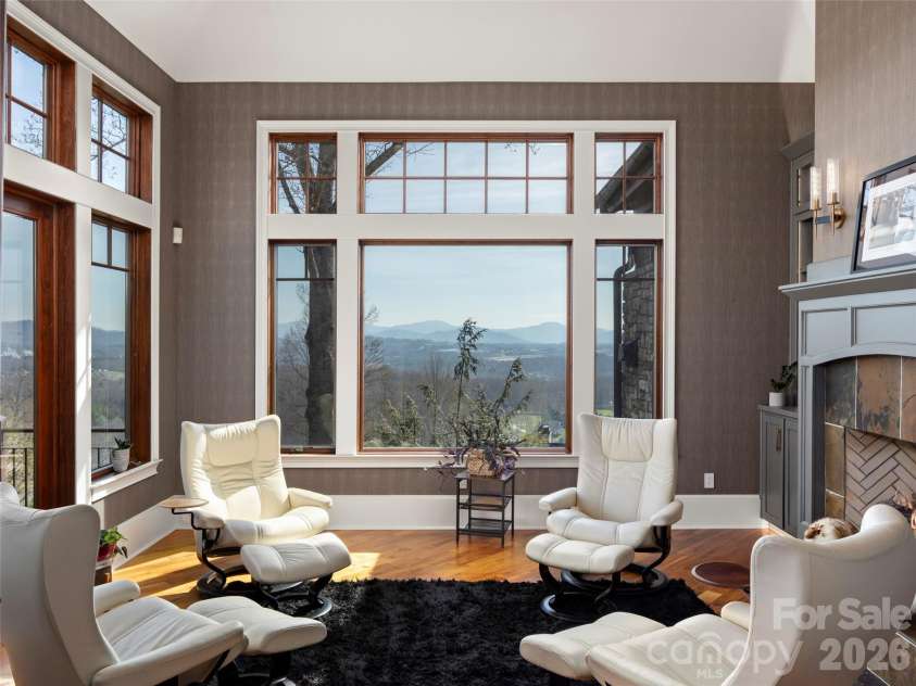 47 Ridge Pine Trail, Arden, NC 28704.  MLS# CAR4370746, YatesRealty ID 30234. Main level sitting room with long range views and door to upper deck