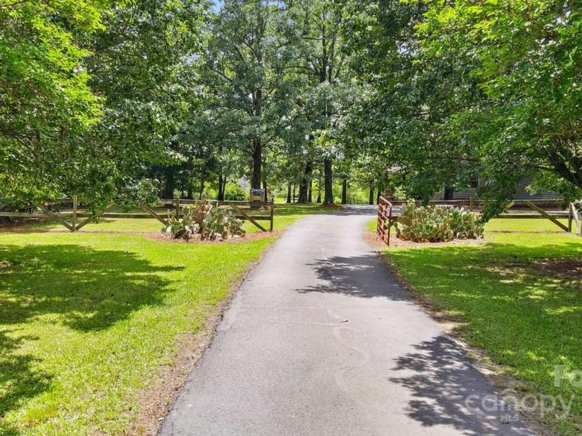 7204 NC 218 Highway, Marshville, NC 28103.  MLS# CAR4273852, YatesRealty ID 30238. Long Private Driveway