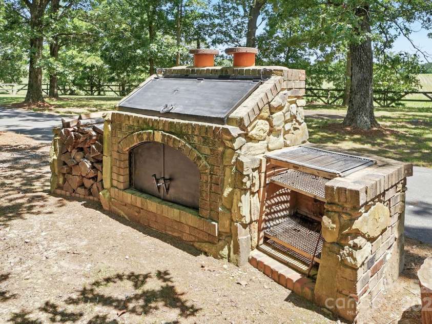 7204 NC 218 Highway, Marshville, NC 28103.  MLS# CAR4273852, YatesRealty ID 30238. Stone Outdoor Kitchen
