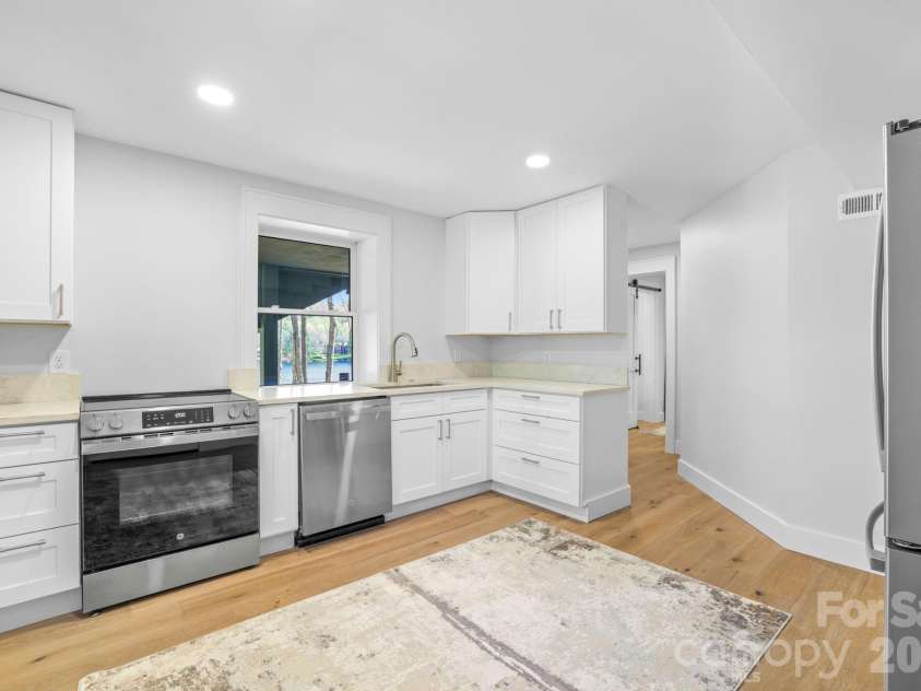 95 Cardinal Trace, Lake Toxaway, NC 28747.  MLS# CAR4376336, YatesRealty ID 30238. Lower Level Kitchen