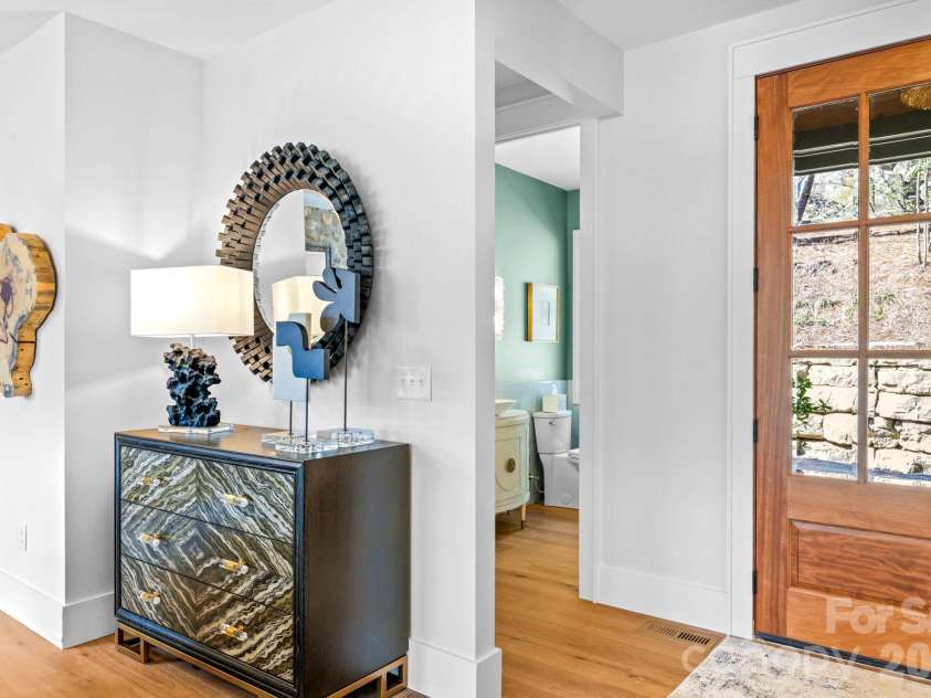 95 Cardinal Trace, Lake Toxaway, NC 28747.  MLS# CAR4431327, YatesRealty ID 30238. Foyer with 1/2 Bath near by