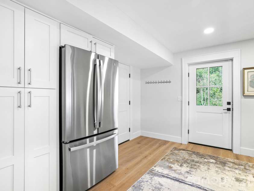 95 Cardinal Trace, Lake Toxaway, NC 28747.  MLS# CAR4431327, YatesRealty ID 30238. Lower Level second Kitchen with direct access to Bed Rm Suite #4, tandem Garage, and lake path to dock