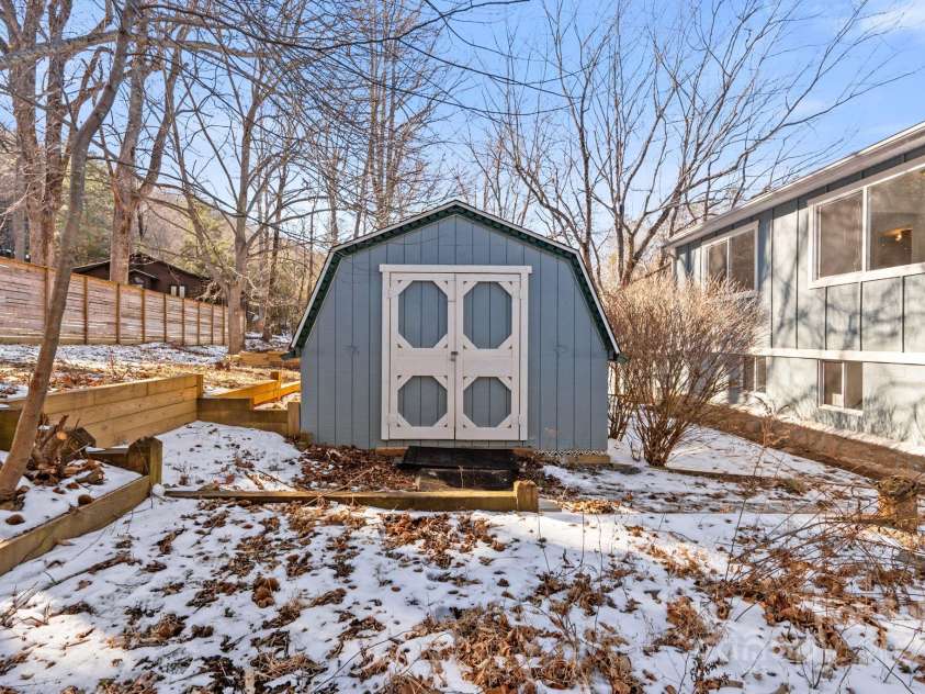 86 Chestnut Hill Road, Gerton, NC 28735.  MLS# CAR4213931, YatesRealty ID 3024. An outbuilding with power provides ample space for tools, equipment, or even a small workshop.