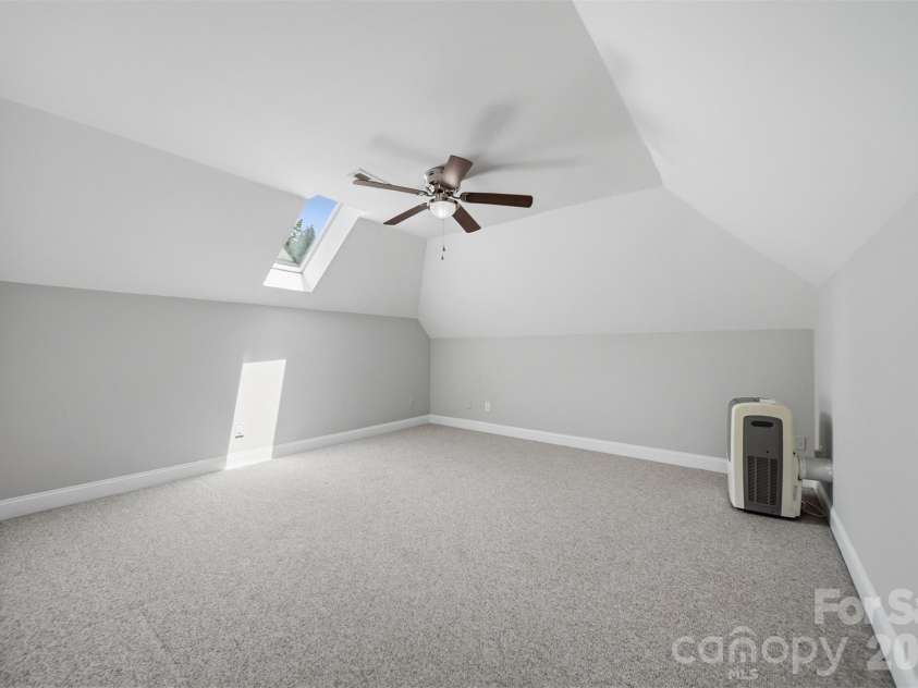 1245 34th Avenue, Hickory, NC 28601.  MLS# CAR4387938, YatesRealty ID 30246. Spacious bonus room with vaulted ceilings and skylight, offering endless possibilities!