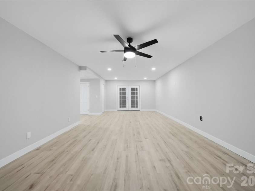1245 34th Avenue, Hickory, NC 28601.  MLS# CAR4387938, YatesRealty ID 30246. Spacious lower-level gathering area with modern finishes and adjoining flex space.