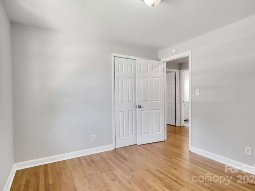 4635 Thornwood Road, Charlotte, NC 28213.  MLS# CAR4276510, YatesRealty ID 30250. Second shot of first bedroom, facing open entry door on right.