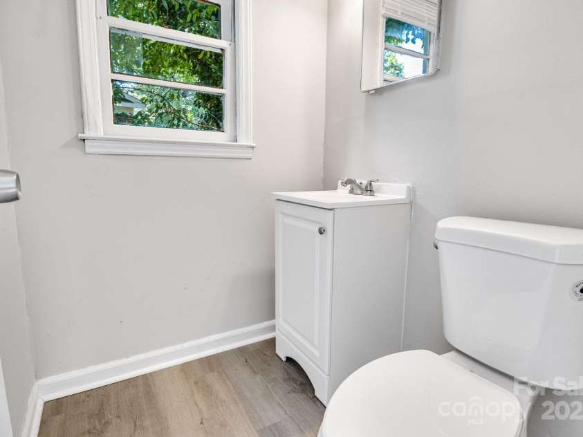 4635 Thornwood Road, Charlotte, NC 28213.  MLS# CAR4276510, YatesRealty ID 30250. Walking into half bathroom connected to lower-level bonus room.
