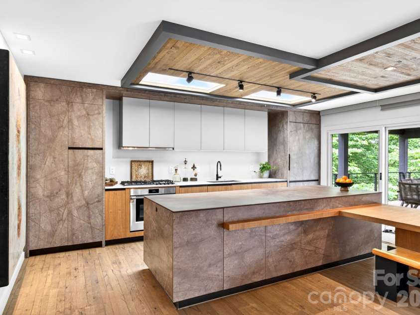 48 Woodvale Avenue, Asheville, NC 28804.  MLS# CAR4387979, YatesRealty ID 30253. Custom ceramic waterfall kitchen island.