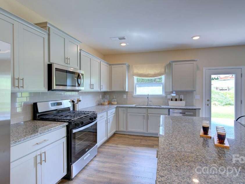 145 Bovine Branch Road, Fletcher, NC 28732.  MLS# CAR4286892, YatesRealty ID 30258. Photos are representative
