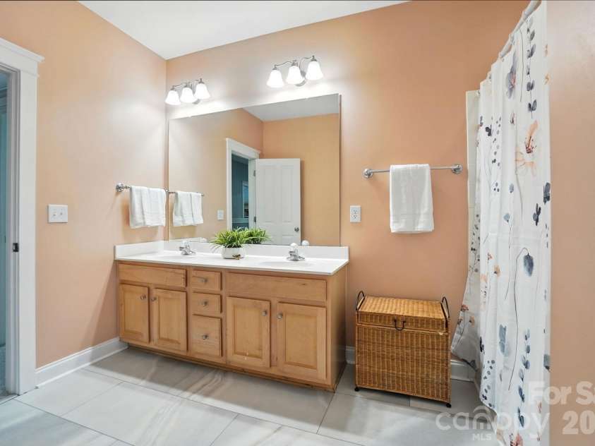 342 Shoreline Parkway, Tega Cay, SC 29708.  MLS# CAR4380050, YatesRealty ID 30261. Each bedroom is conveniently connected to a bathroom, providing comfort and functionality.