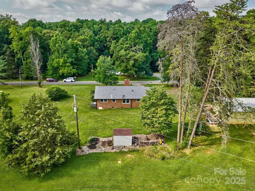 7753 Caswell Road, Stanley, NC 28164.  MLS# CAR4276529, YatesRealty ID 30264. Aerial view of rear of home