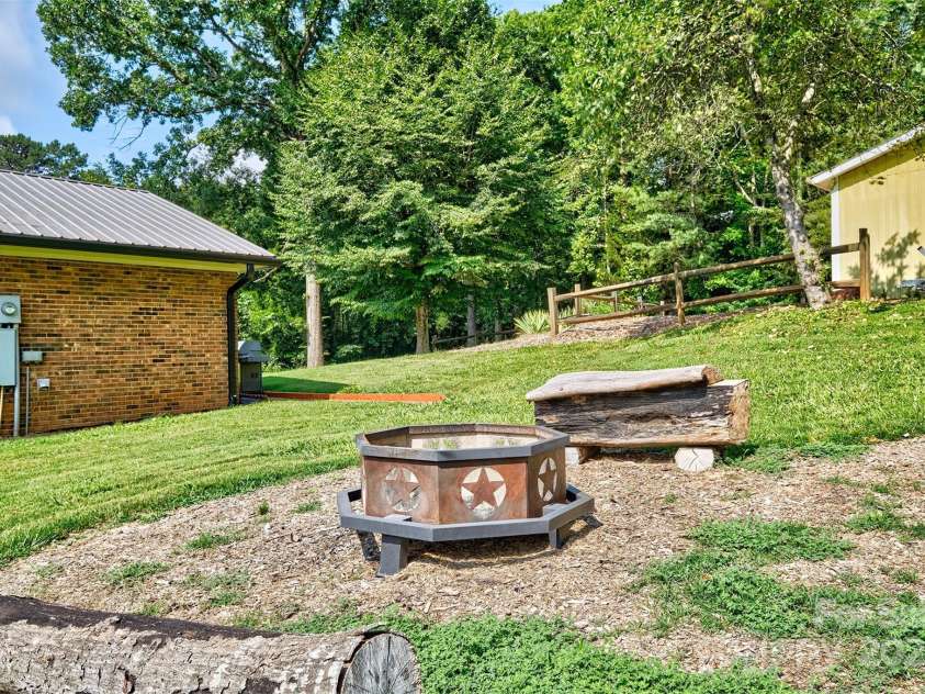 7753 Caswell Road, Stanley, NC 28164.  MLS# CAR4276529, YatesRealty ID 30264. Fire pit area