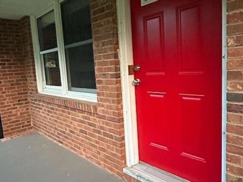 7753 Caswell Road, Stanley, NC 28164.  MLS# CAR4276529, YatesRealty ID 30264. Rocking chair front porch