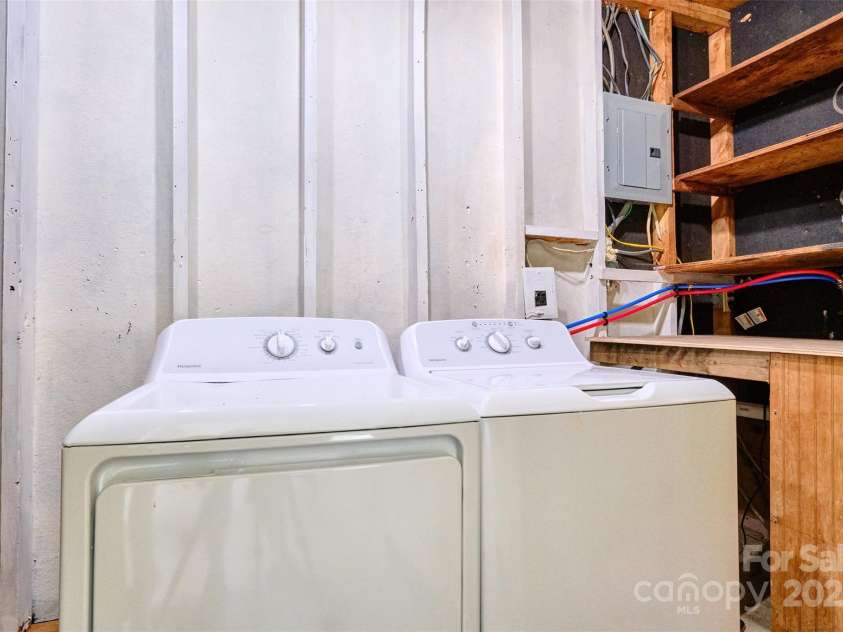 7753 Caswell Road, Stanley, NC 28164.  MLS# CAR4276529, YatesRealty ID 30264. Utility room in carport holds washer & dryer