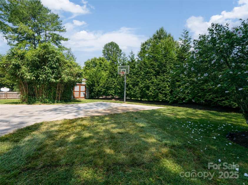 206 Pinner Road, Arden, NC 28704.  MLS# CAR4276364, YatesRealty ID 30266. 10 x 20 shed nestled between the trees
