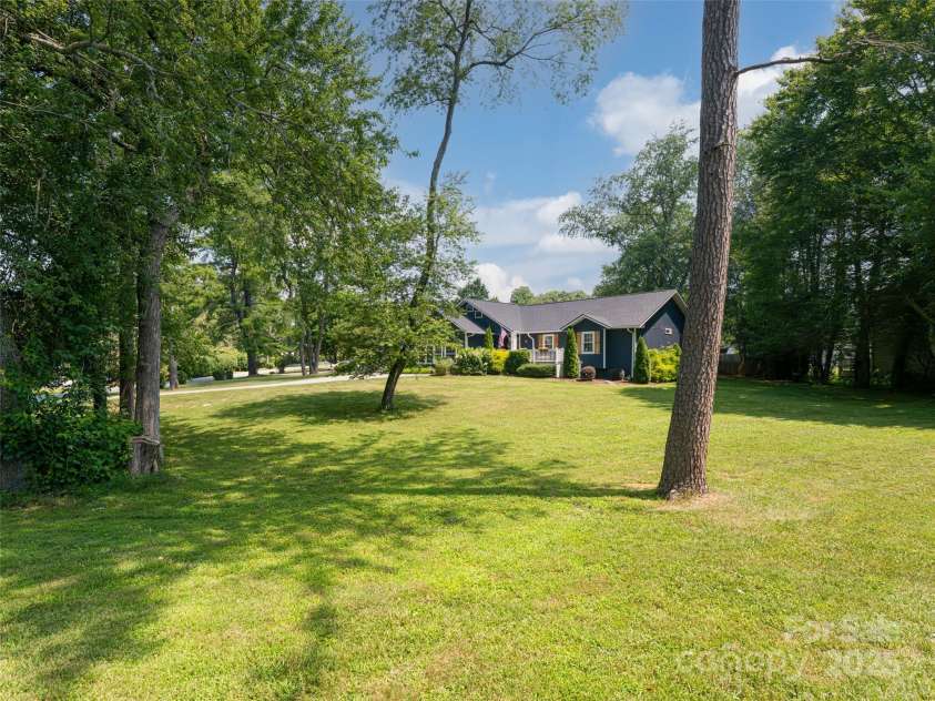 206 Pinner Road, Arden, NC 28704.  MLS# CAR4276364, YatesRealty ID 30266. Large .78 acre lot with trees and abundant landscaping.