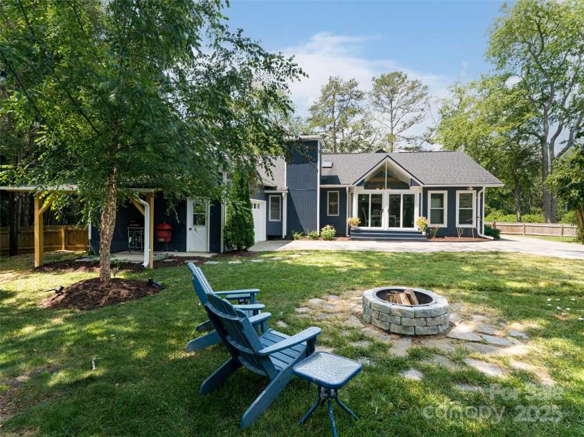 206 Pinner Road, Arden, NC 28704.  MLS# CAR4276364, YatesRealty ID 30266. Lets cook out under the covered porch and then have s'mores by the fire!