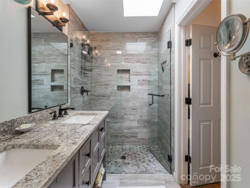 206 Pinner Road, Arden, NC 28704.  MLS# CAR4276364, YatesRealty ID 30266. Spa like walk in shower and sky lights