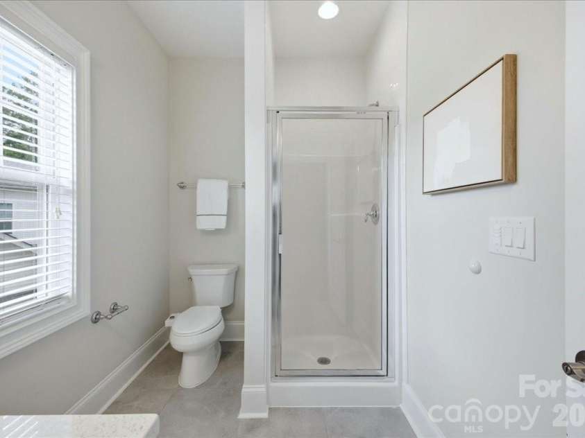 1103 Sharon Amity Road, Charlotte, NC 28211.  MLS# CAR4384442, YatesRealty ID 30270. Upstairs Primary Bathroom