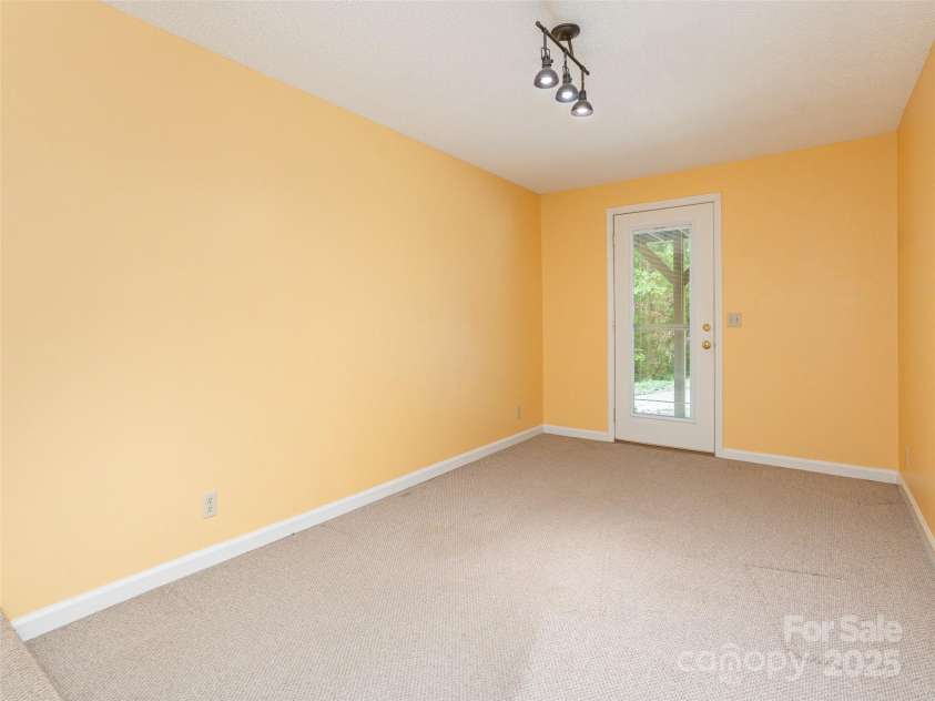 55 Willow Bend, Hendersonville, NC 28792.  MLS# CAR4255625, YatesRealty ID 30273. Lower level finished space, perfect for home office, recreation, playroom, or gym.