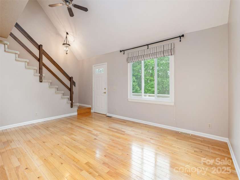 55 Willow Bend, Hendersonville, NC 28792.  MLS# CAR4255625, YatesRealty ID 30273. Open staircase to upper level overlooking living room.