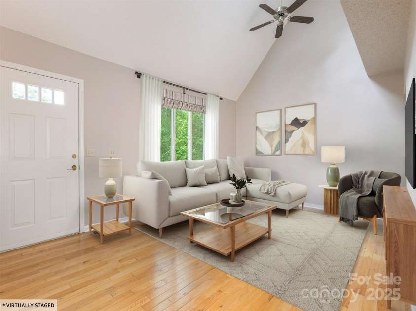 55 Willow Bend, Hendersonville, NC 28792.  MLS# CAR4255625, YatesRealty ID 30273. Spacious living room with vaulted ceilings and hardwood floors