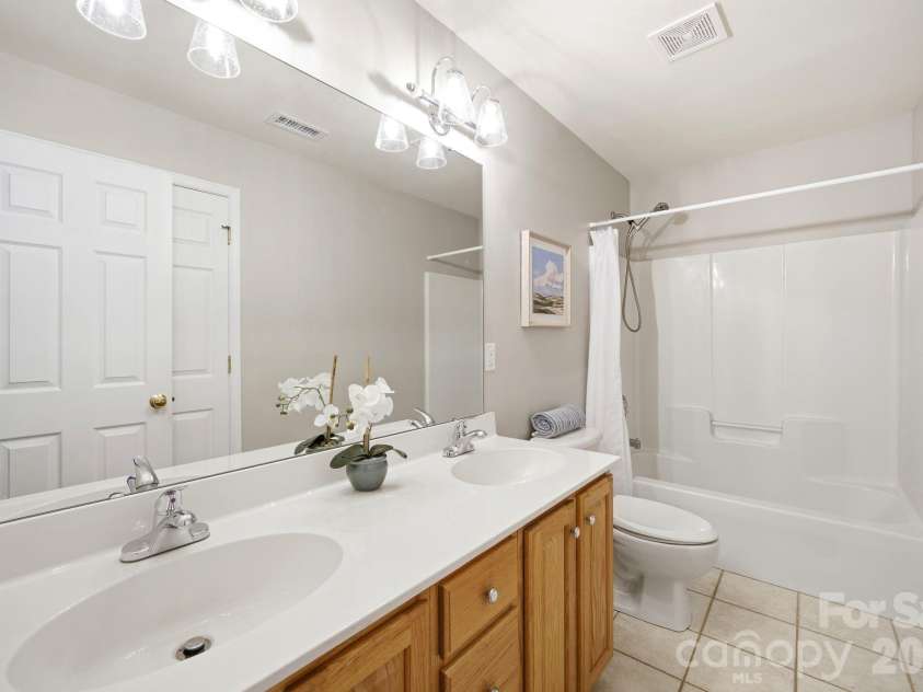 2937 Shady Reach Lane, Charlotte, NC 28214.  MLS# CAR4391581, YatesRealty ID 30285. Hall Bathroom with Dual Sinks