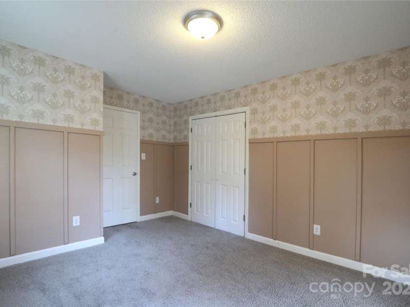 14027 Hackamore Drive, Matthews, NC 28105.  MLS# CAR4265300, YatesRealty ID 30286. Front bedroom