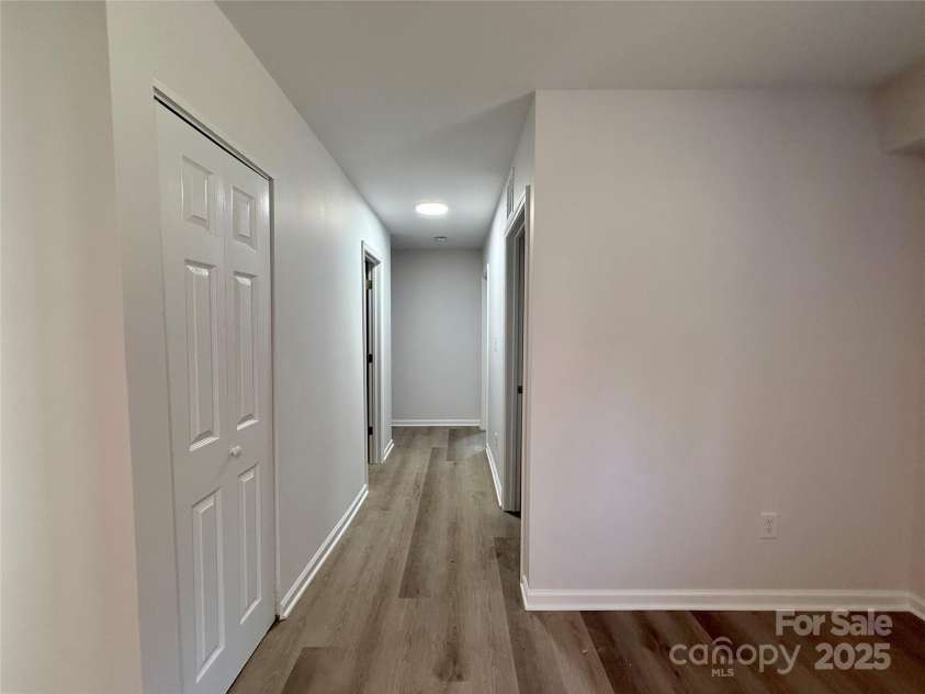 1902 5th Avenue, Gastonia, NC 28052.  MLS# CAR4283317, YatesRealty ID 30289. Living Hall to back bedrooms in the lower level unit