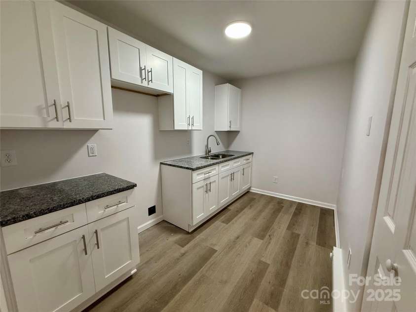 1902 5th Avenue, Gastonia, NC 28052.  MLS# CAR4283317, YatesRealty ID 30289. Lower Level unit kitchen