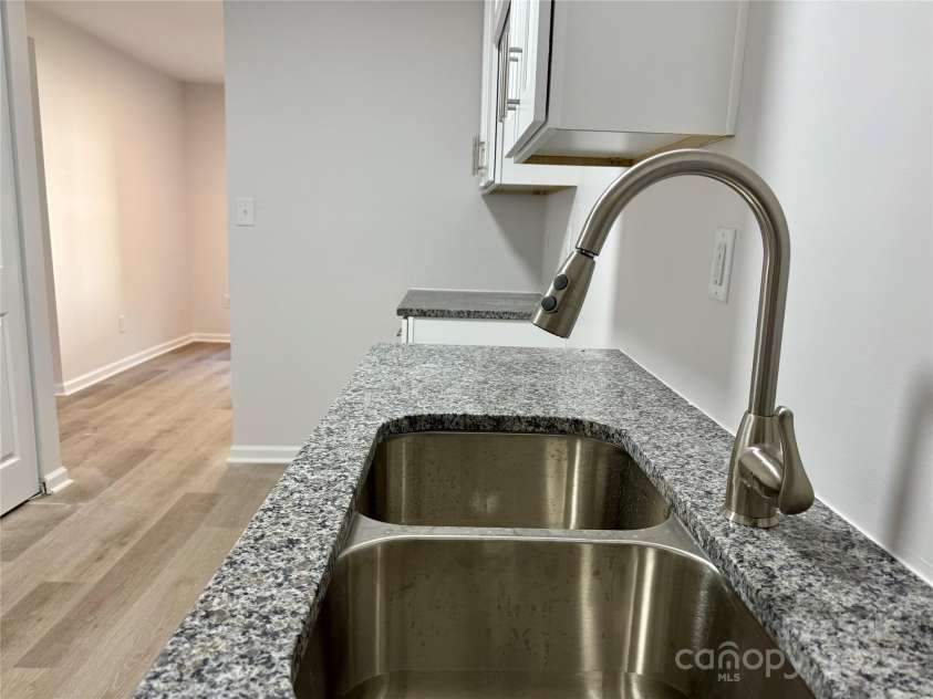1902 5th Avenue, Gastonia, NC 28052.  MLS# CAR4283317, YatesRealty ID 30289. Lower Level unit kitchen