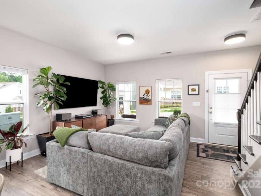 58 Walnut Springs Drive, Asheville, NC 28804.  MLS# CAR4259966, YatesRealty ID 30297. Living room includes large windows and light filtration shades