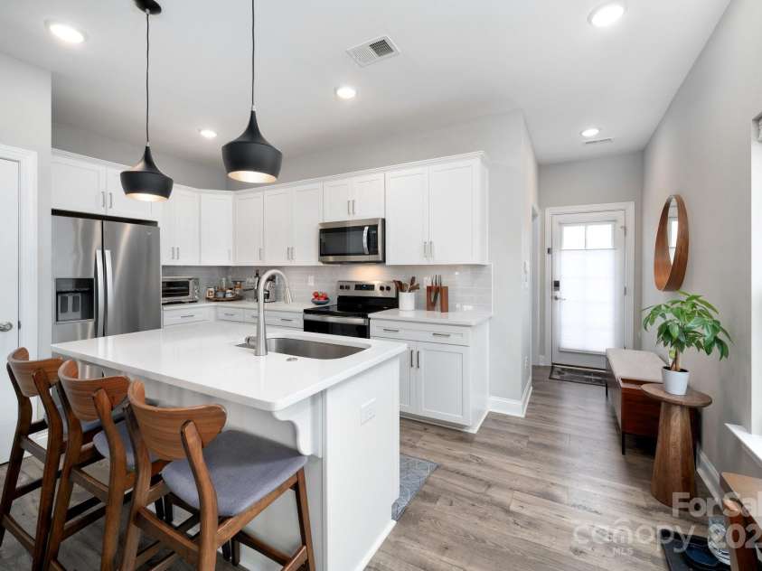 58 Walnut Springs Drive, Asheville, NC 28804.  MLS# CAR4259966, YatesRealty ID 30297. Primary bedroom off kitchen