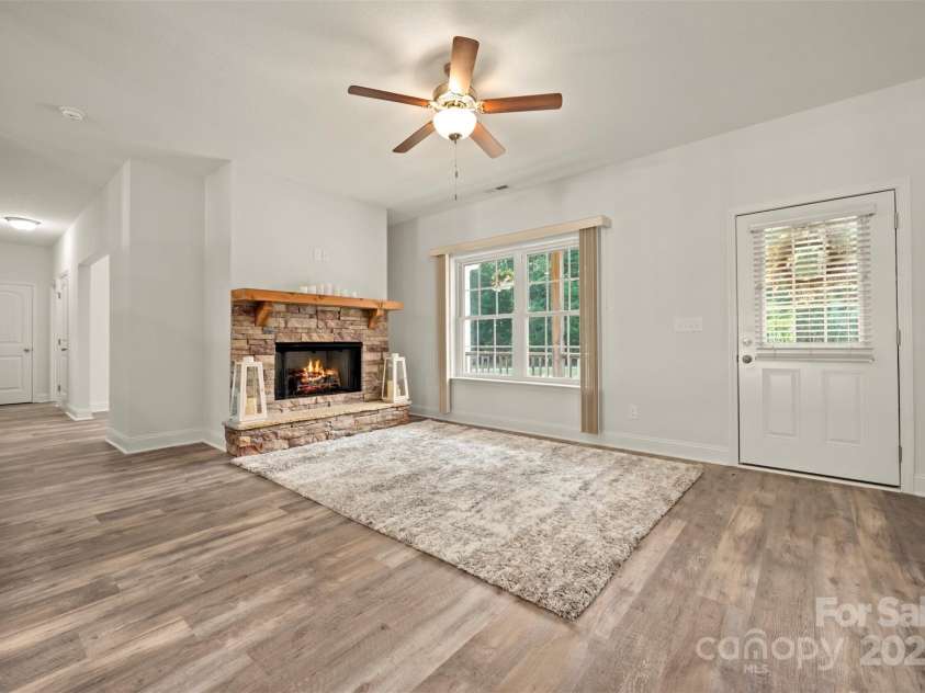 321 Benjamins Way, Hendersonville, NC 28792.  MLS# CAR4276870, YatesRealty ID 303. Living room with gas fireplace