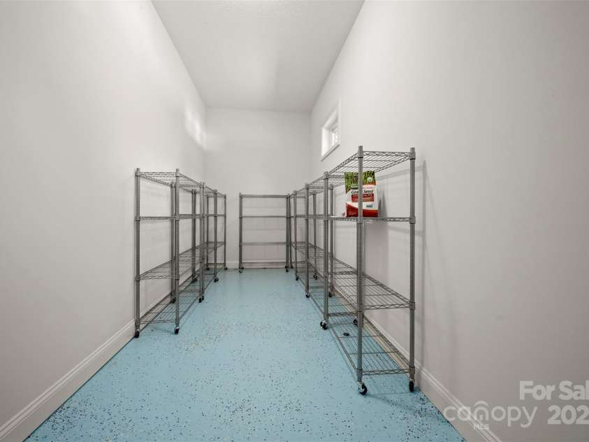 321 Benjamins Way, Hendersonville, NC 28792.  MLS# CAR4276870, YatesRealty ID 303. Nice storage/workshop area in the rear of the garage