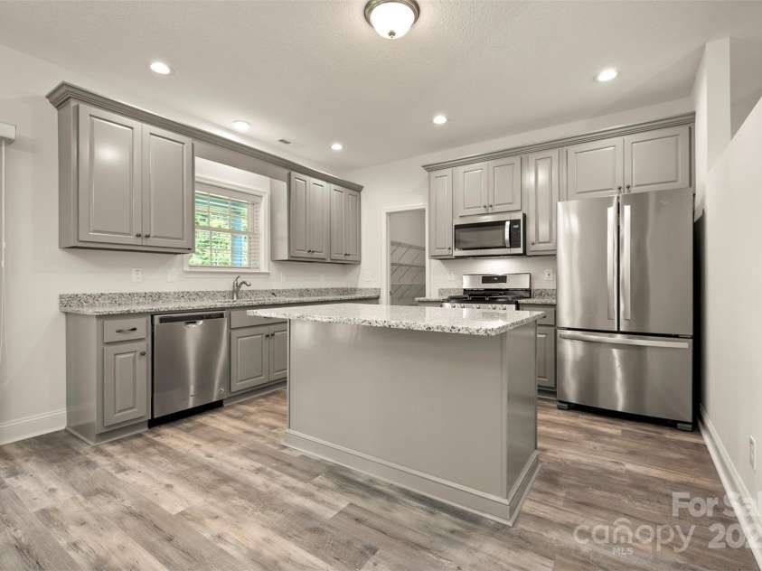 321 Benjamins Way, Hendersonville, NC 28792.  MLS# CAR4276870, YatesRealty ID 303. Spacious kitchen with stainless appliances