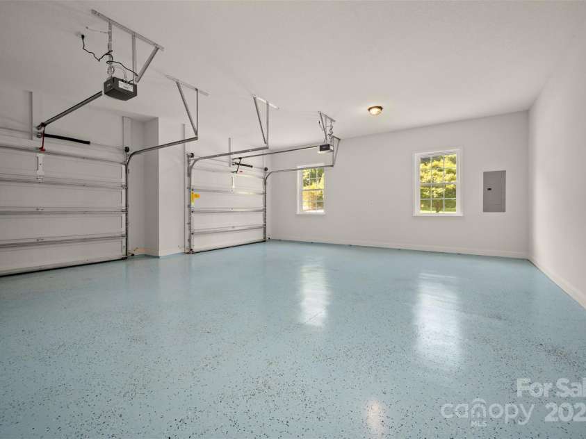 321 Benjamins Way, Hendersonville, NC 28792.  MLS# CAR4276870, YatesRealty ID 303. Two car garage with epoxy floor coating