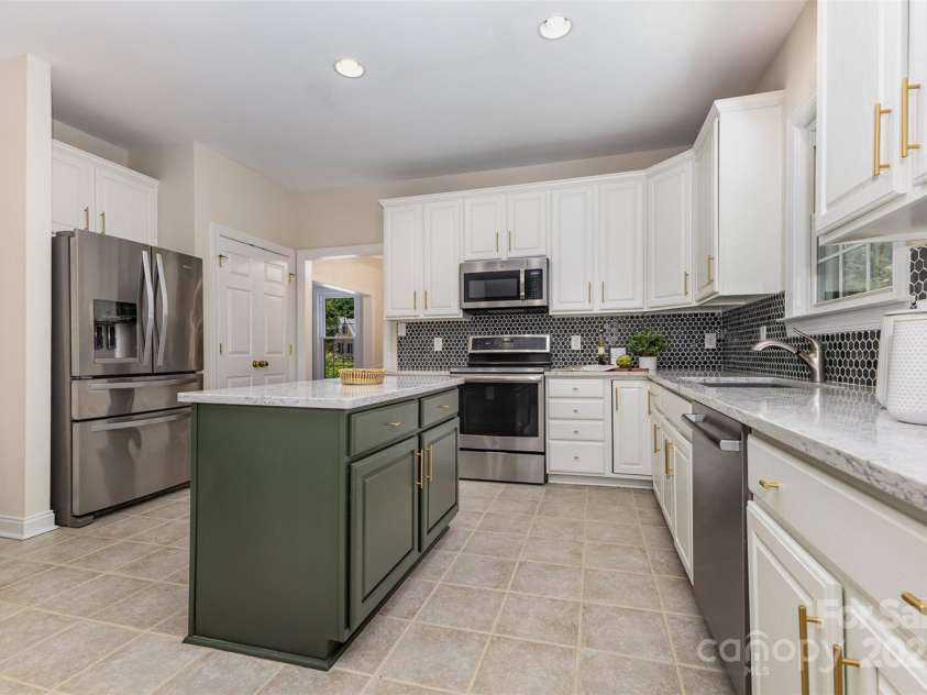2919 Shady Reach Lane, Charlotte, NC 28214.  MLS# CAR4272489, YatesRealty ID 30305. Kitchen island provides extra storage
