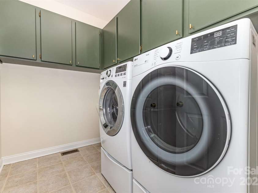 2919 Shady Reach Lane, Charlotte, NC 28214.  MLS# CAR4272489, YatesRealty ID 30305. Laundry room has freshly painted cabinets and new hardware