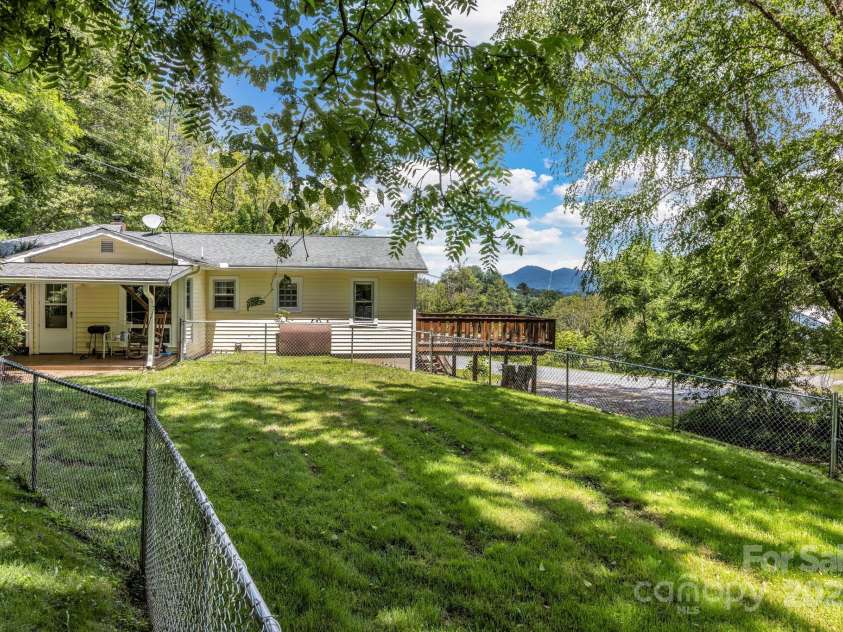 48 Allen Drive, Waynesville, NC 28786.  MLS# CAR4278077, YatesRealty ID 30310. Fenced side yard
