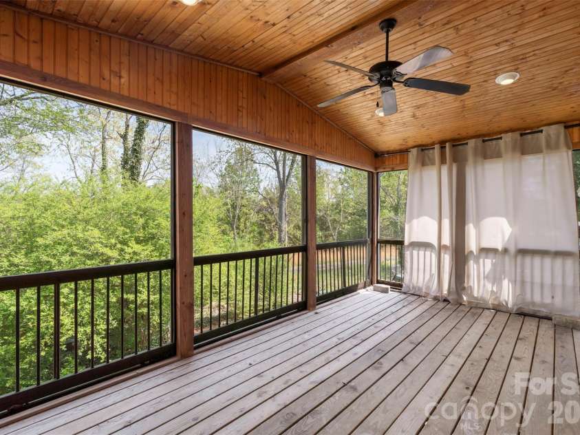 7619 Mariner Cove Drive, Cornelius, NC 28031.  MLS# CAR4357290, YatesRealty ID 30312. Screened Balcony off Primary Bedroom