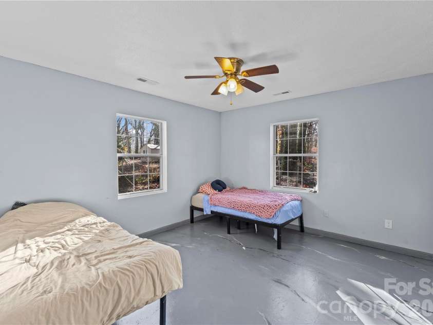 117 Robinson Avenue, Matthews, NC 28104.  MLS# CAR4388191, YatesRealty ID 30314. ADU Main Bedroom