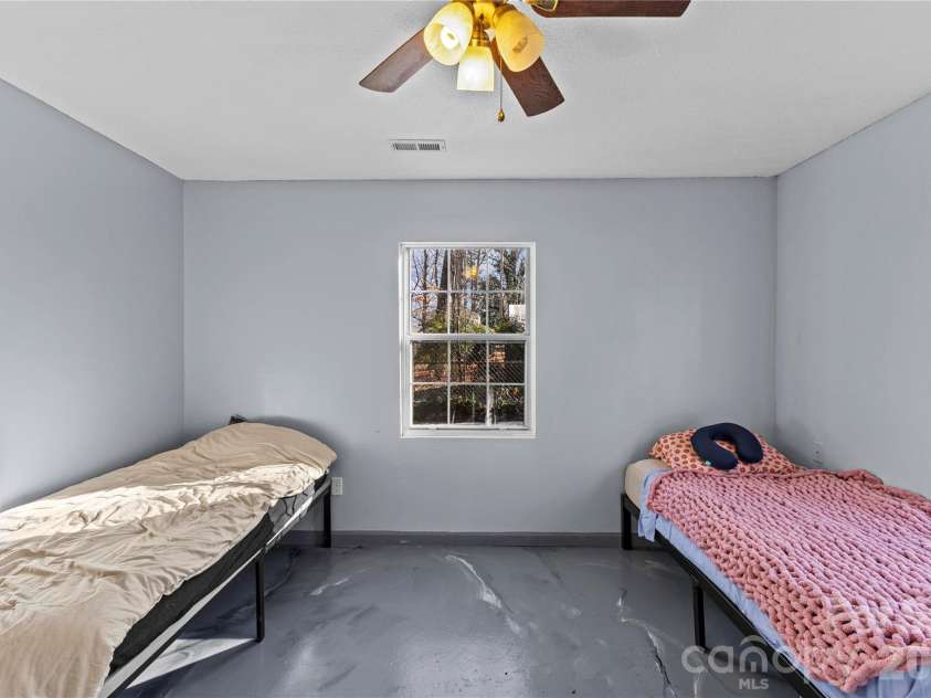 117 Robinson Avenue, Matthews, NC 28104.  MLS# CAR4388191, YatesRealty ID 30314. ADU Main Bedroom